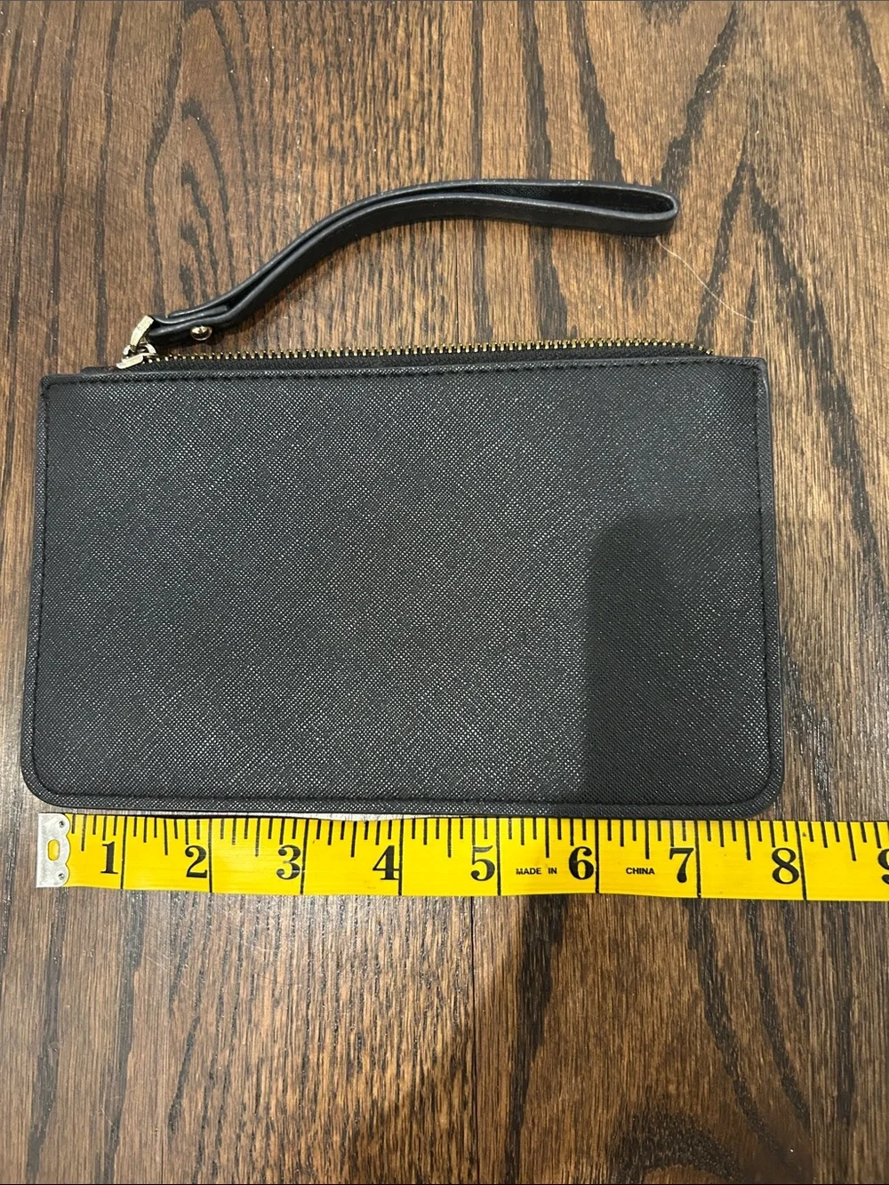 kate spade black and gold wristlet pouch
